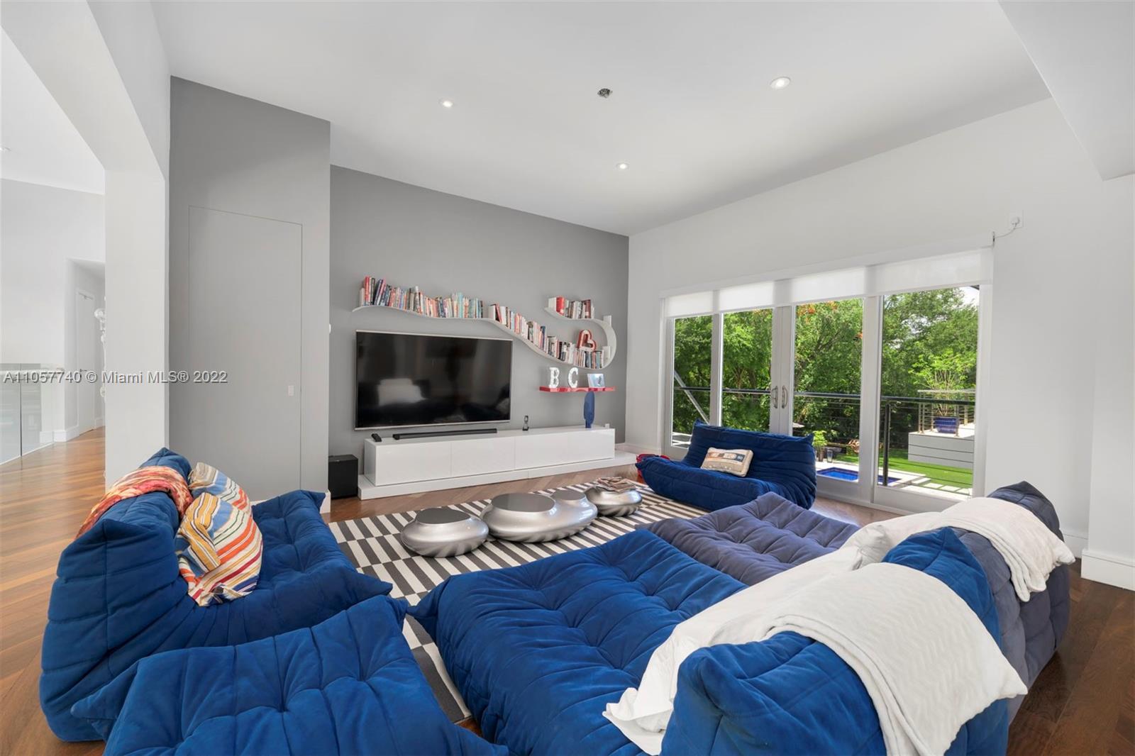 5030 Davis Road Miami, FL 33143 - Photo 9 of 29 a living room with furniture and a flat screen tv