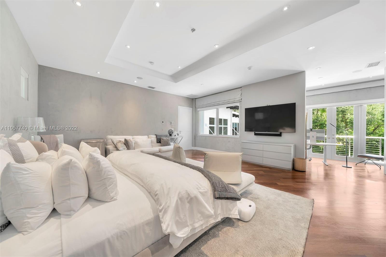 5030 Davis Road Miami, FL 33143 - Photo 10 of 29 a spacious bedroom with a bed and a flat screen tv