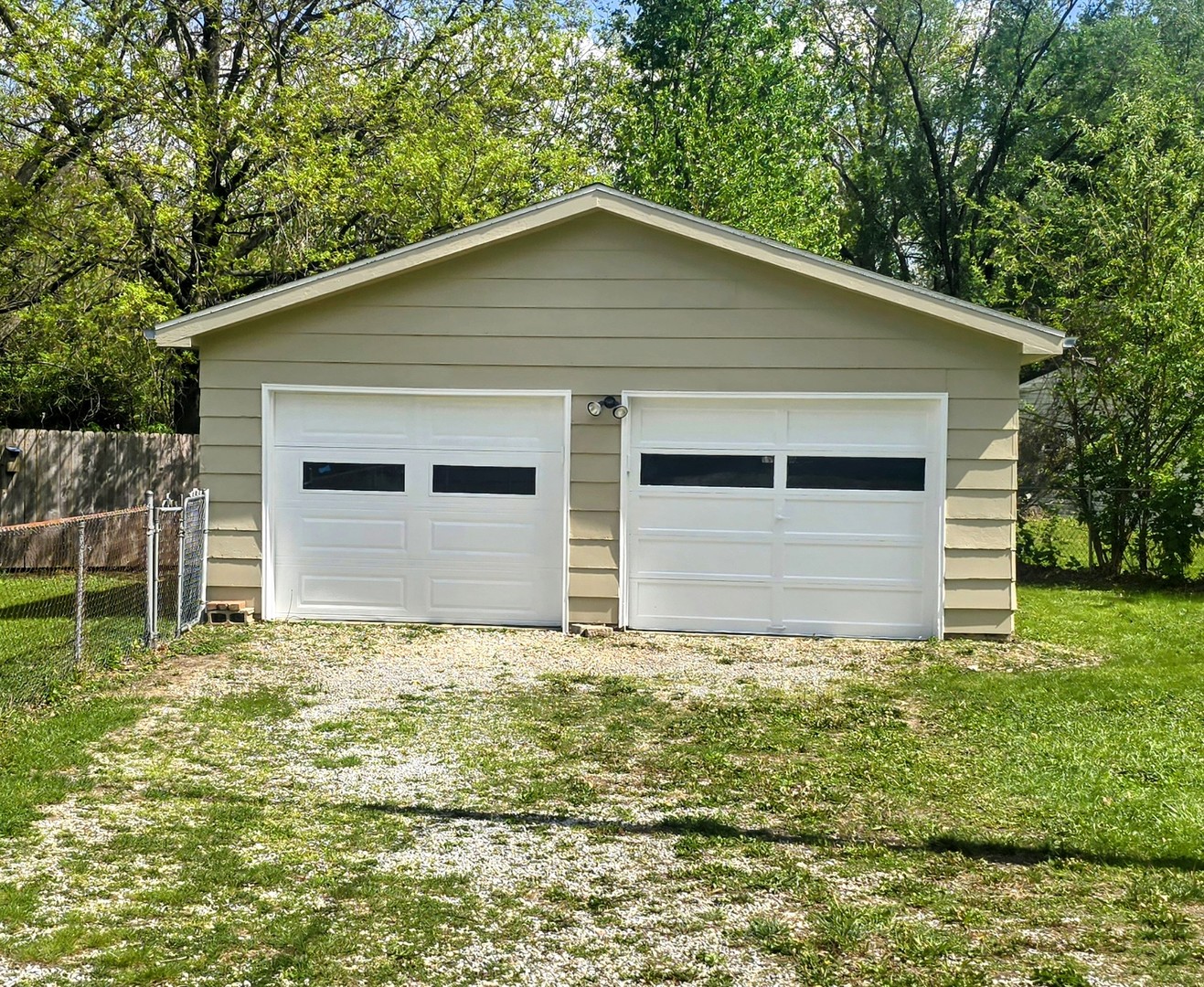 829 East Old Rte 47 Monticello, IL 61856 - Photo 15 of 16 a house with green field in front of it