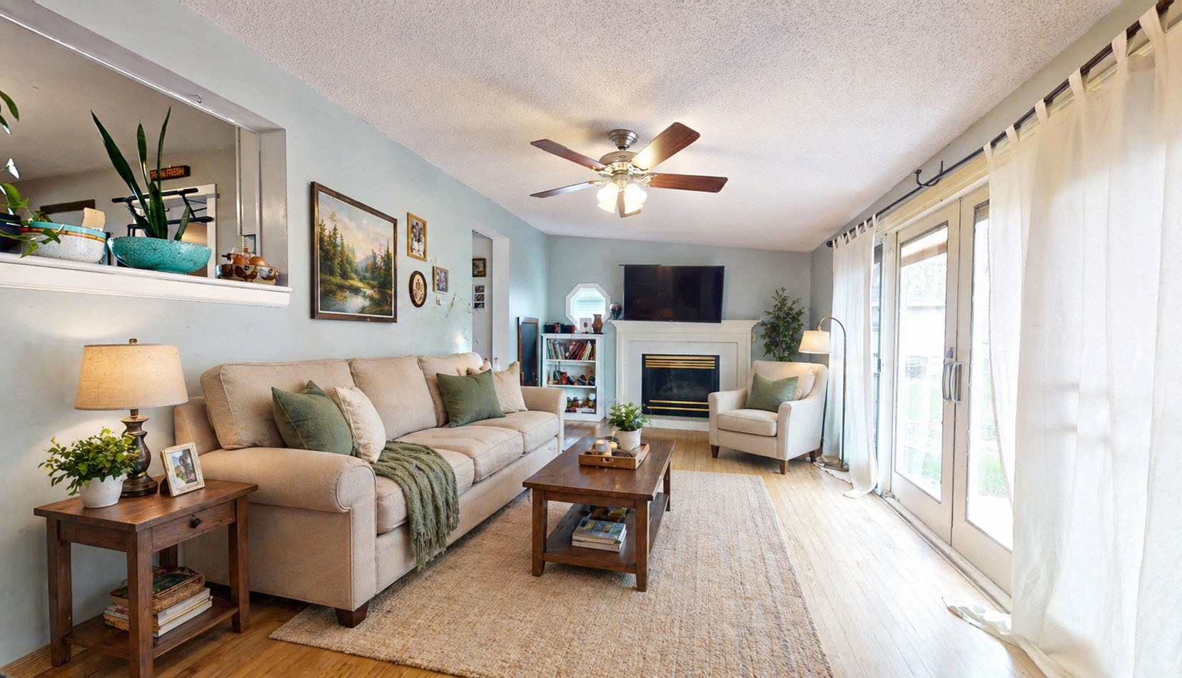 829 East Old Rte 47 Monticello, IL 61856 - Photo 5 of 16 a living room with furniture a fireplace and a flat screen tv