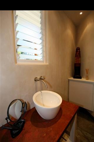 111 Door Of Faith Road Haiku, HI 96708 - Photo 12 of 23 a bathroom with a sink and a mirror
