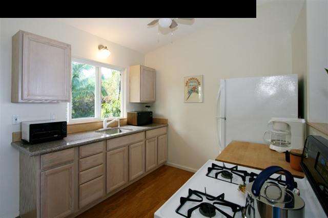 111 Door Of Faith Road Haiku, HI 96708 - Photo 13 of 23 a kitchen with a sink and a stove top oven