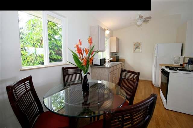 111 Door Of Faith Road Haiku, HI 96708 - Photo 14 of 23 a view of a dining room with furniture window and wooden floor