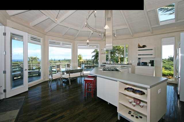 111 Door Of Faith Road Haiku, HI 96708 - Photo 4 of 23 a open kitchen with stainless steel appliances granite countertop a sink and wooden floors