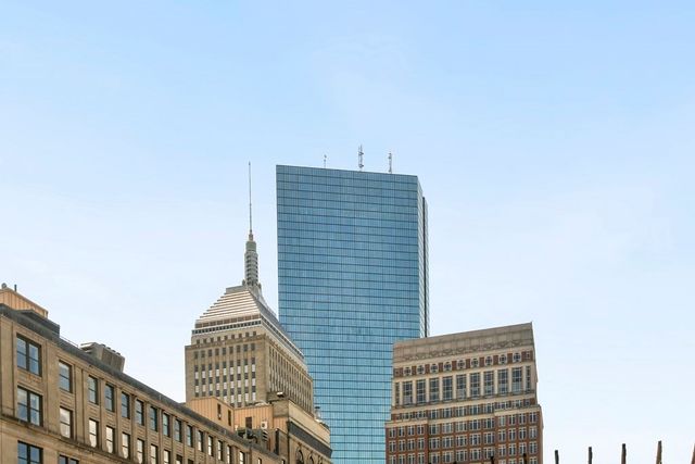 a bathroom with a shower sink and mirror