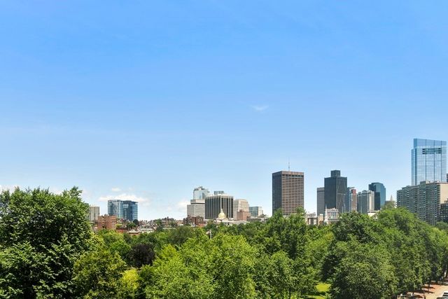 a view of a city with tall buildings in the background