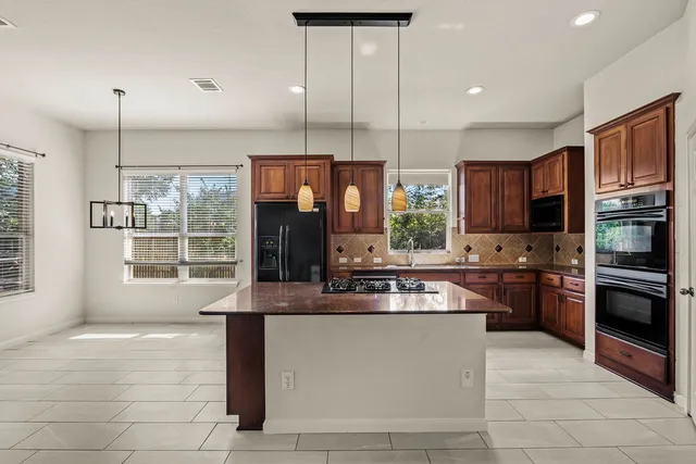 a living room with furniture a fireplace