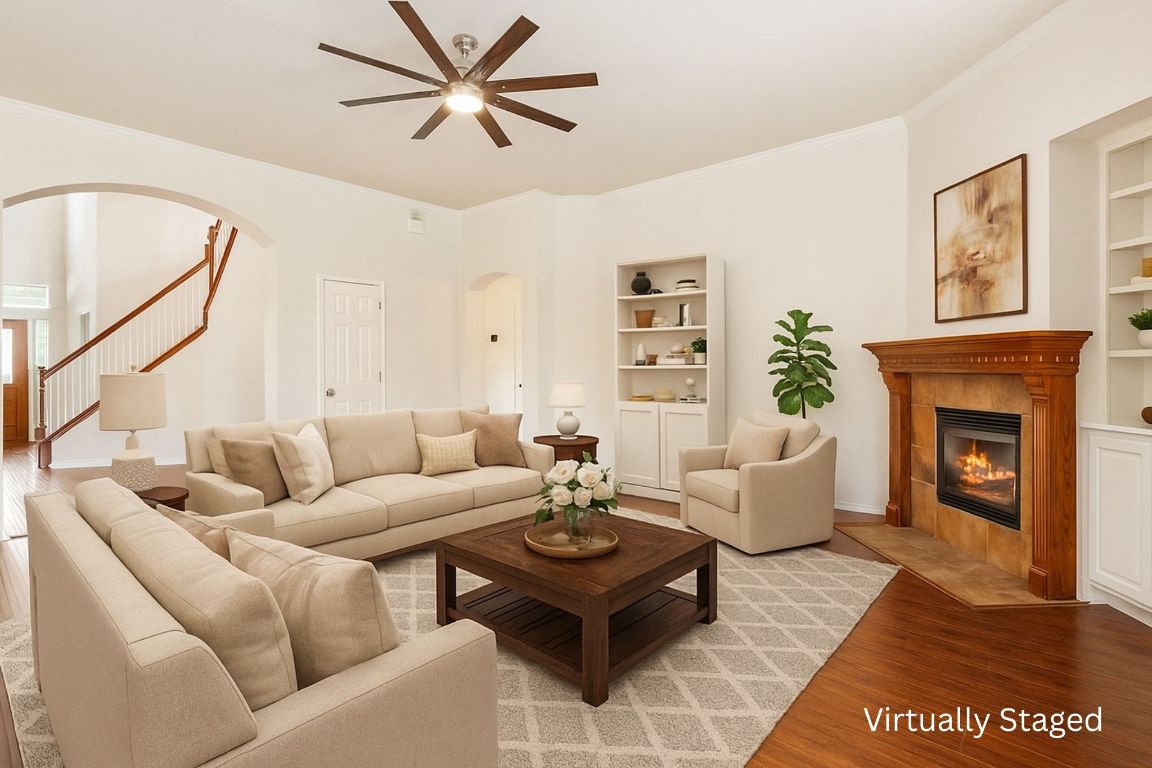 102 Country View Way Cedar Park, TX 78613 - Photo 14 of 38 Living room featuring arched walkways, ceiling fan, light wood-style floors, built in shelves, and crown molding