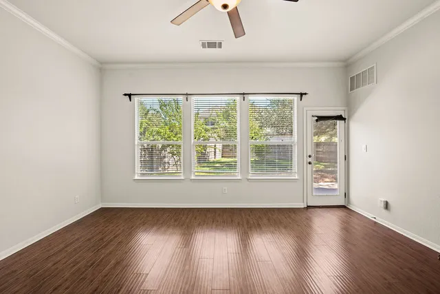 a view of a bathroom with mirror and double vanity