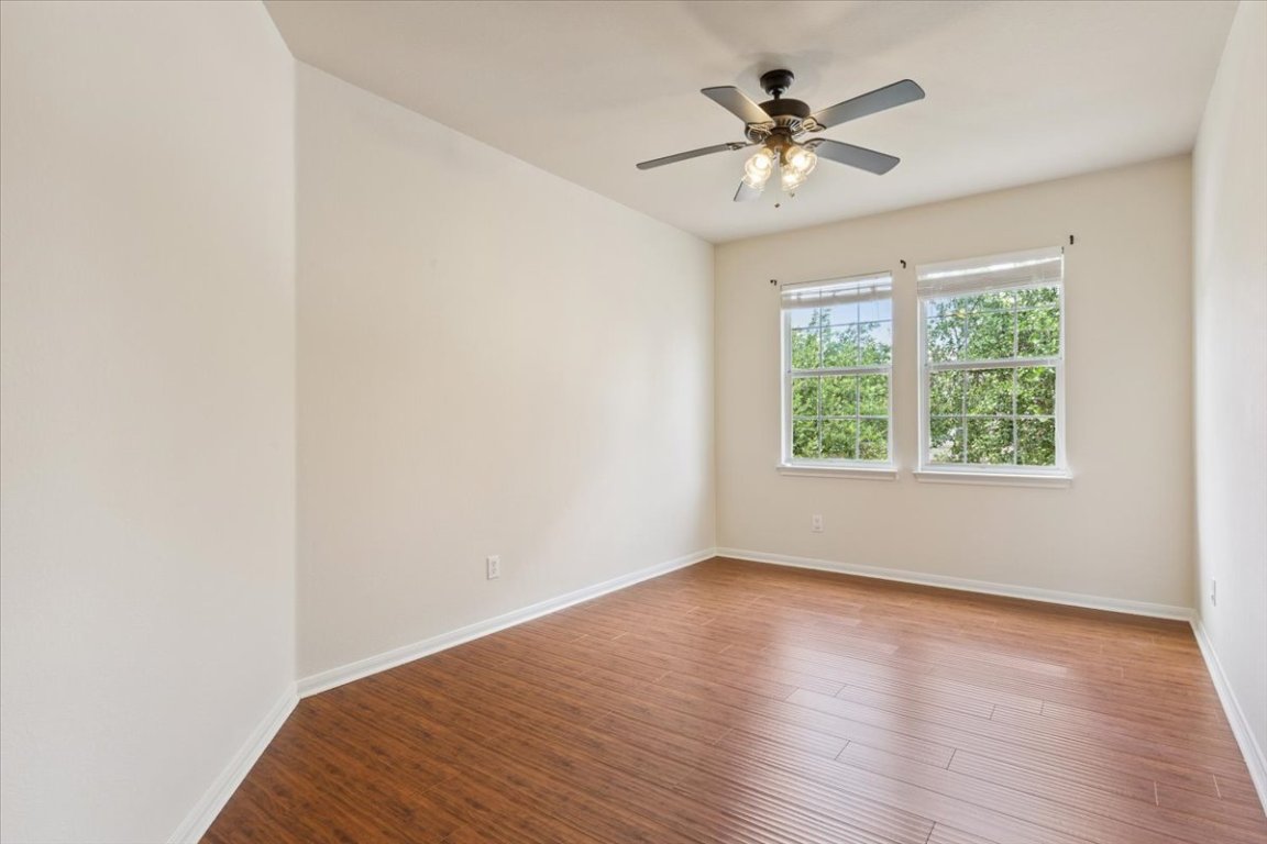 102 Country View Way Cedar Park, TX 78613 - Photo 22 of 38 Spare room featuring a ceiling fan and wood finished floors