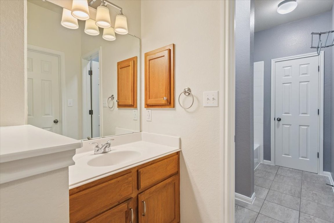 102 Country View Way Cedar Park, TX 78613 - Photo 23 of 38 Full bathroom featuring vanity and tile patterned floors