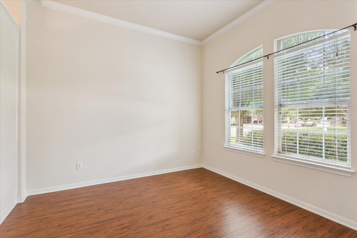102 Country View Way Cedar Park, TX 78613 - Photo 27 of 38 Spare room featuring wood finished floors and ornamental molding