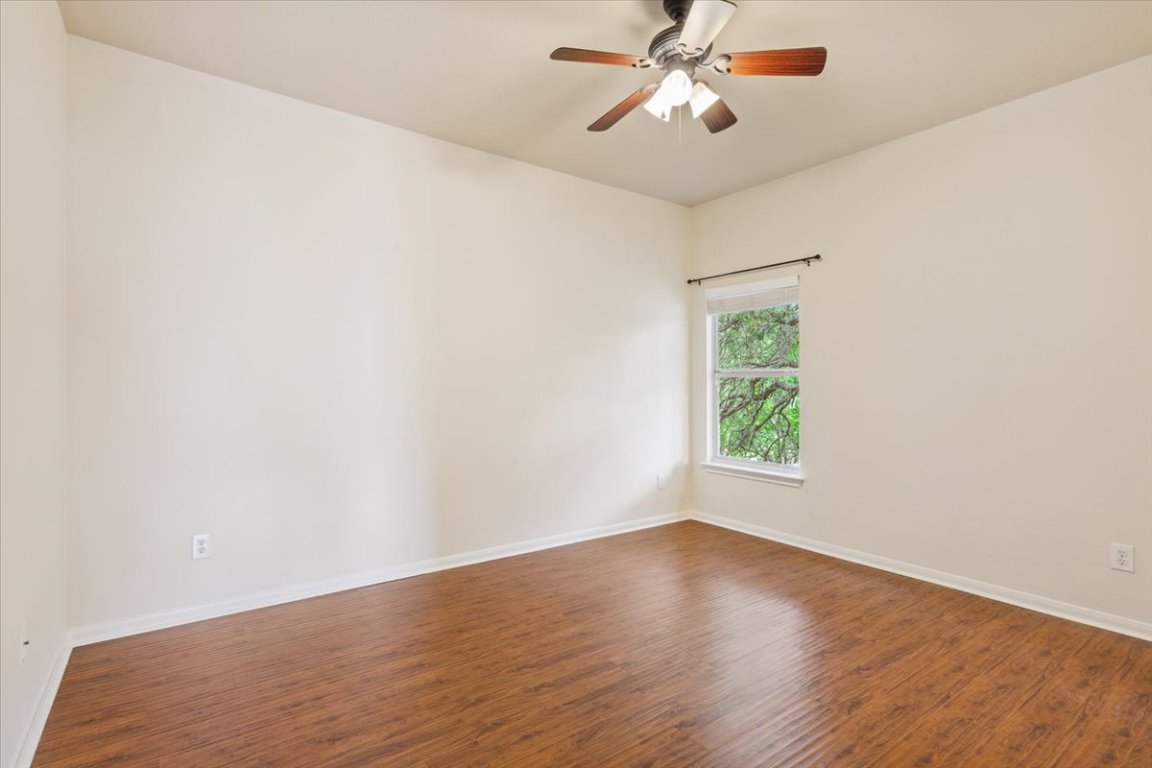 102 Country View Way Cedar Park, TX 78613 - Photo 30 of 38 Empty room featuring wood finished floors and a ceiling fan