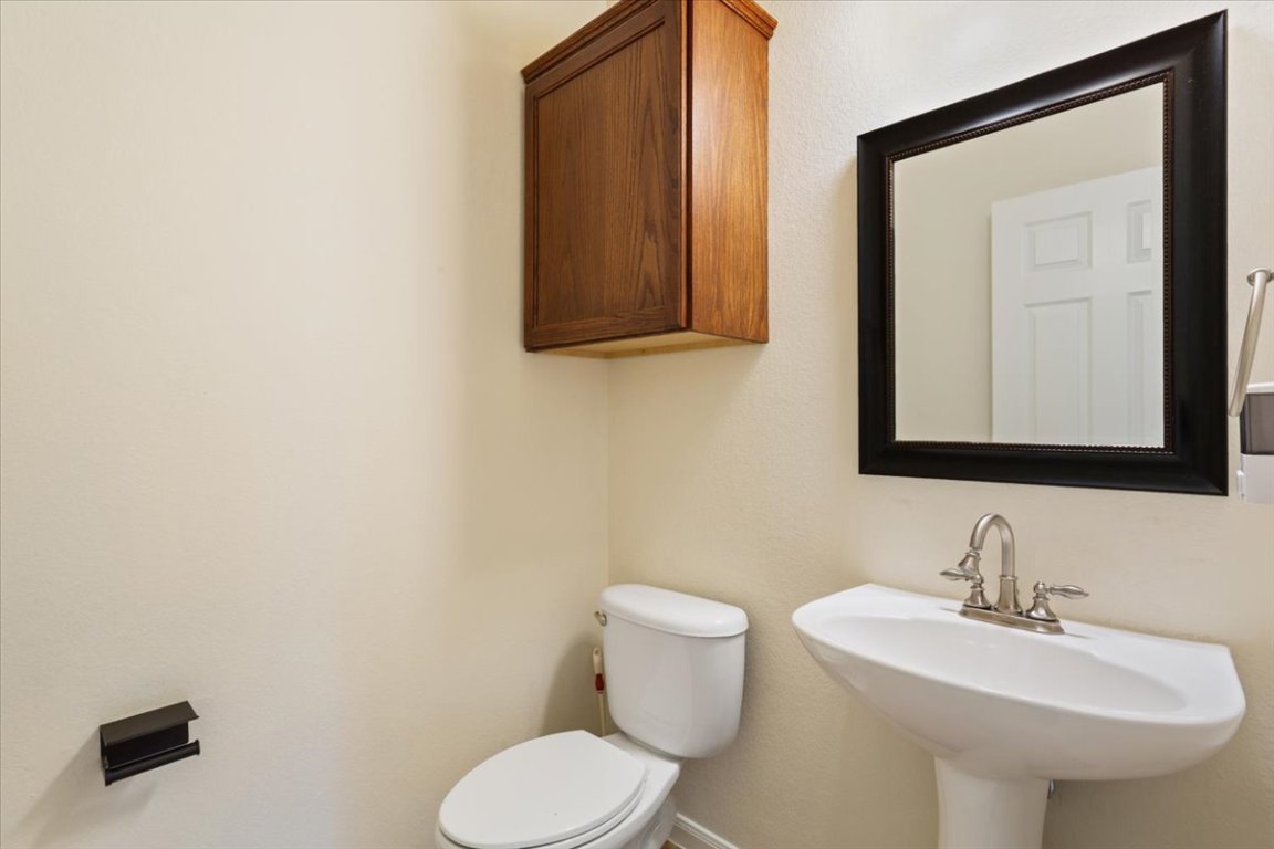 102 Country View Way Cedar Park, TX 78613 - Photo 31 of 38 Half bath with toilet and a sink