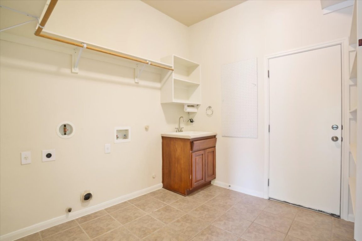 102 Country View Way Cedar Park, TX 78613 - Photo 32 of 38 Laundry area featuring electric dryer hookup, hookup for a gas dryer, washer hookup, and light tile patterned floors