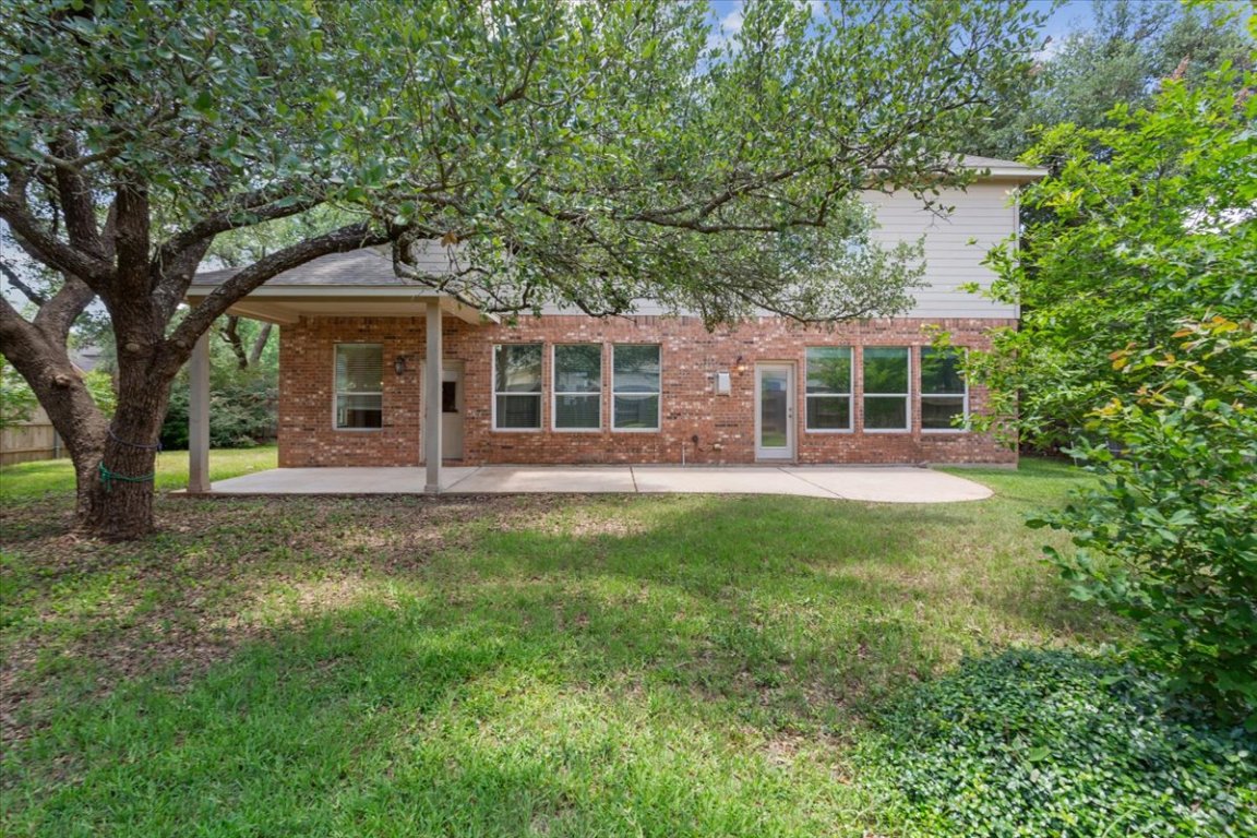 102 Country View Way Cedar Park, TX 78613 - Photo 35 of 38 Rear view of property with a patio, brick siding, and a yard