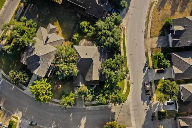 an aerial view of residential house with outdoor space