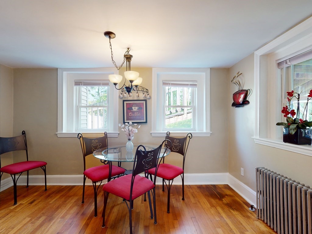 54 Carlin Road Waltham, MA 02451 - Photo 6 of 41 a view of a dining room with furniture window and wooden floor