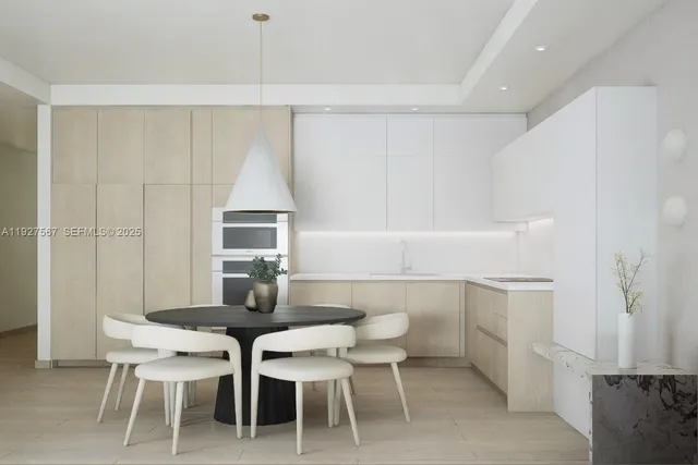 a view of a dining room with furniture and window