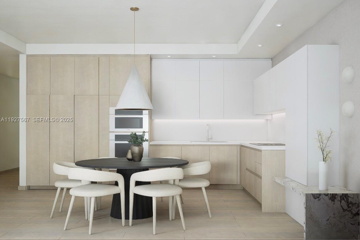 a view of a dining room with furniture and window