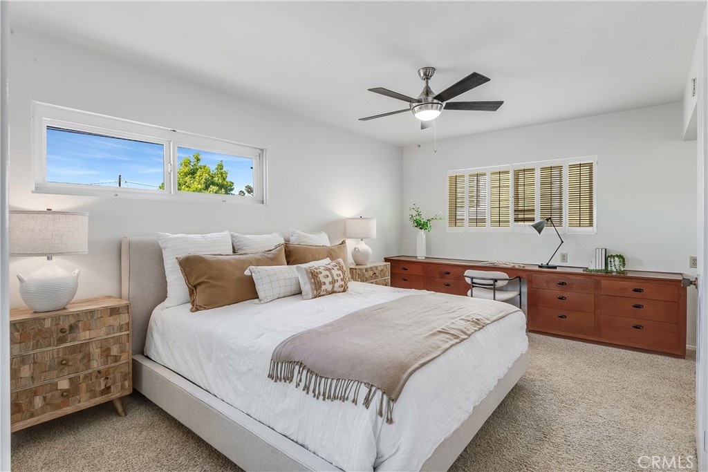 214 Angelo Walk Long Beach, CA 90803 - Photo 19 of 36 a bedroom with a bed and wooden floor