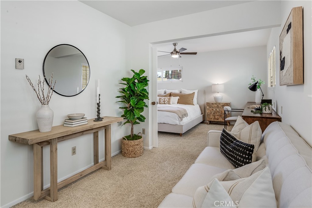 214 Angelo Walk Long Beach, CA 90803 - Photo 21 of 36 a living room with furniture a mirror and a potted plant
