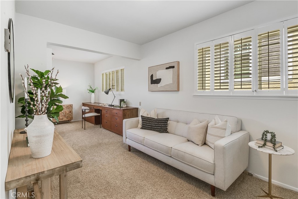 214 Angelo Walk Long Beach, CA 90803 - Photo 22 of 36 a living room with furniture and a potted plant