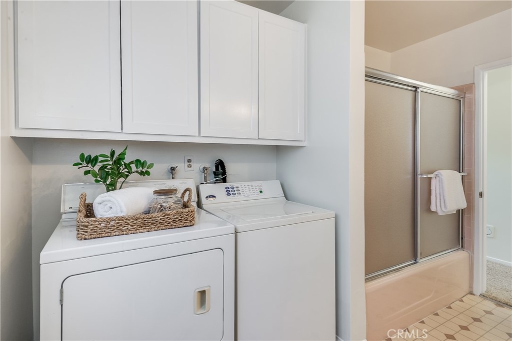 214 Angelo Walk Long Beach, CA 90803 - Photo 26 of 36 a utility room with dryer and washer