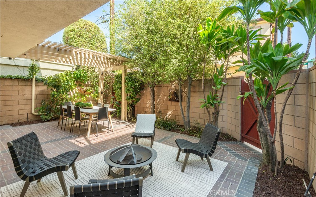 214 Angelo Walk Long Beach, CA 90803 - Photo 30 of 36 a view of a patio with couple of chairs and a table