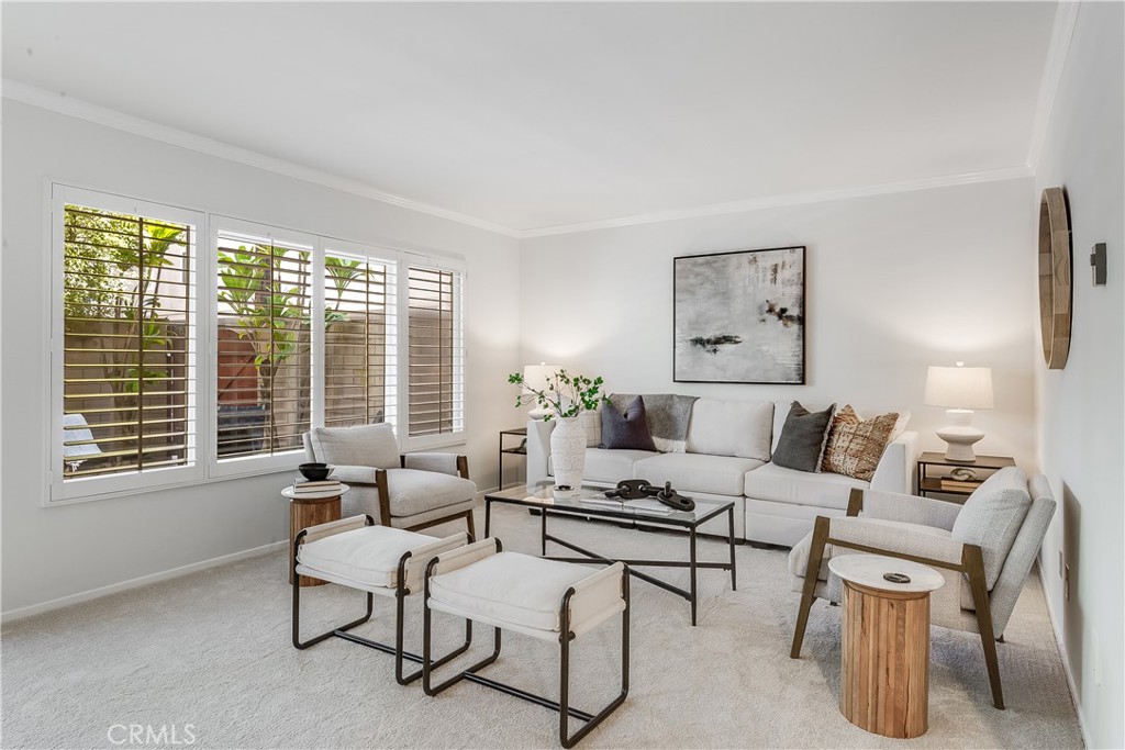 214 Angelo Walk Long Beach, CA 90803 - Photo 7 of 36 a living room with furniture and a large window