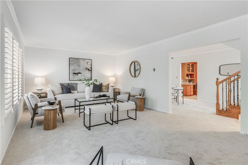 214 Angelo Walk Long Beach, CA 90803 - Photo 8 of 36 a living room with furniture and paintings on the wall