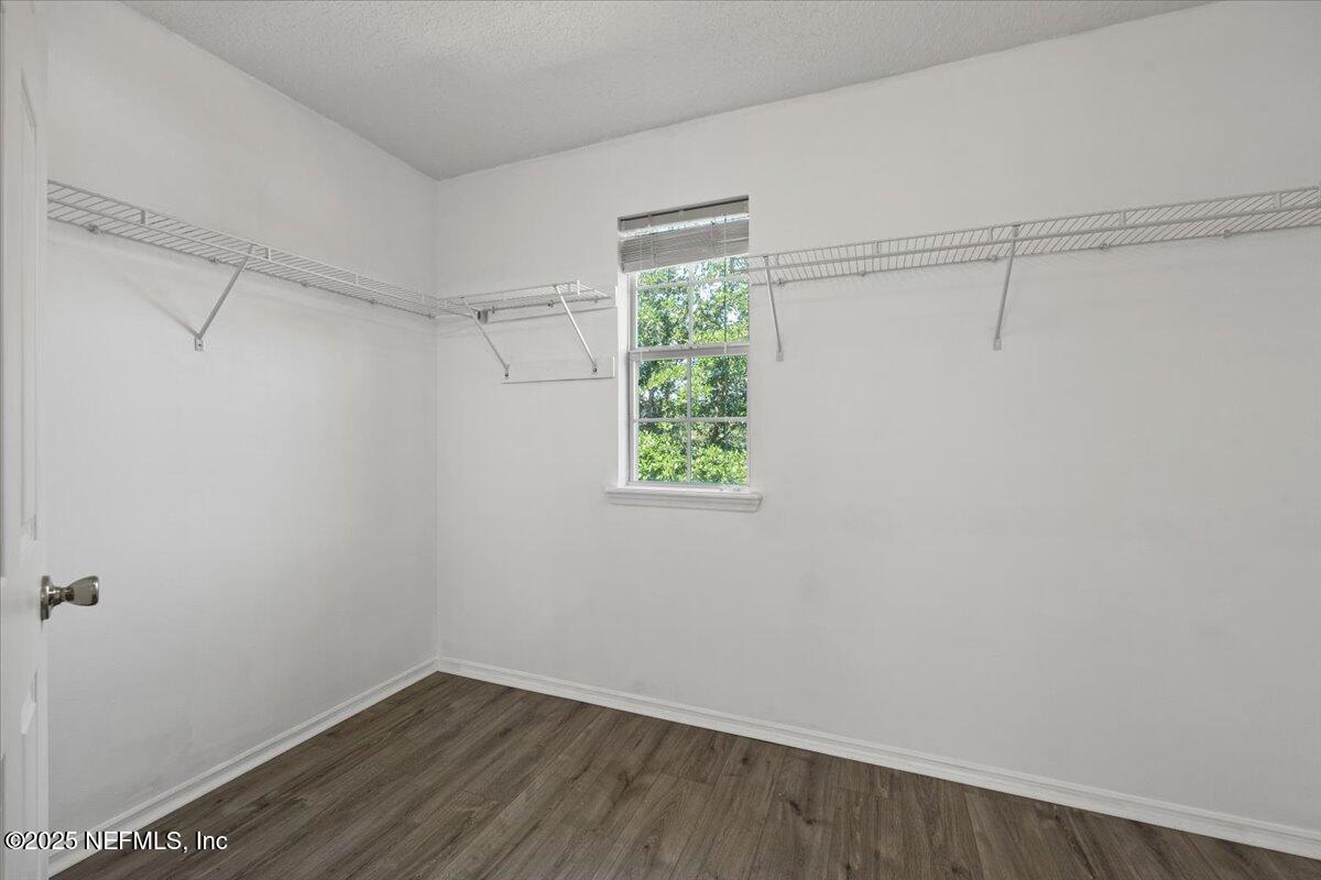 77347 Cobblestone Drive Yulee, FL 32097 - Photo 27 of 35 a view of a small space with wooden floor and a window