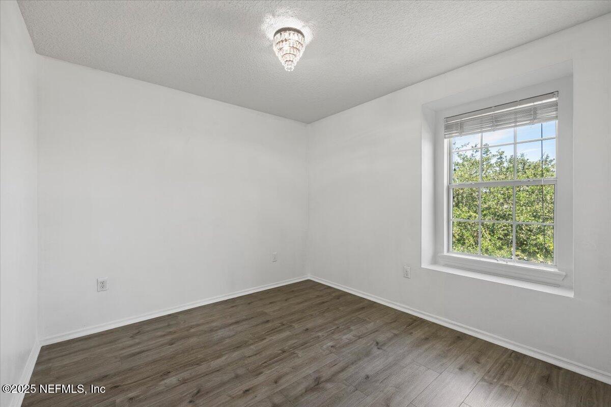 77347 Cobblestone Drive Yulee, FL 32097 - Photo 30 of 35 an empty room with a window