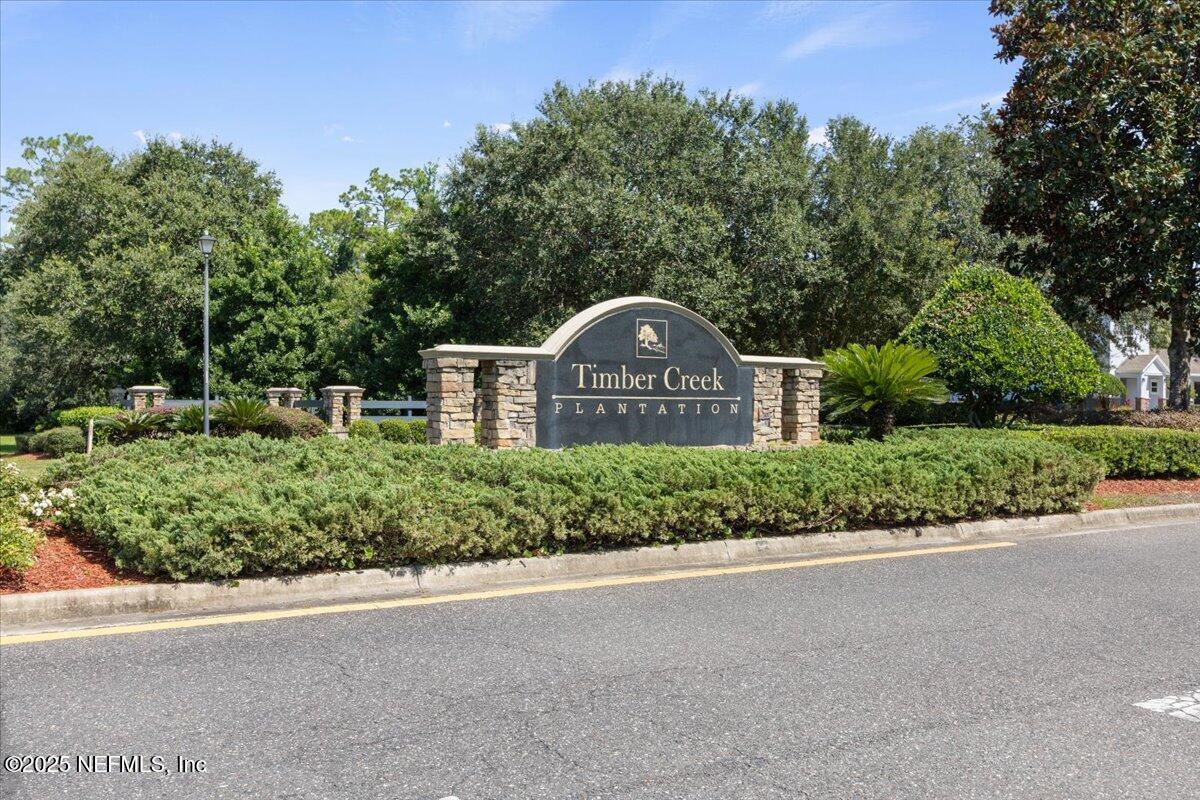 77347 Cobblestone Drive Yulee, FL 32097 - Photo 35 of 35 a view of a street with a park