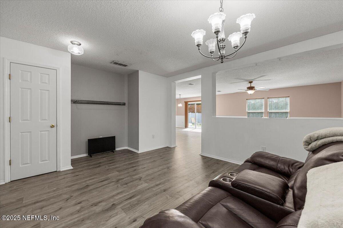 77347 Cobblestone Drive Yulee, FL 32097 - Photo 7 of 35 a view of a livingroom with furniture