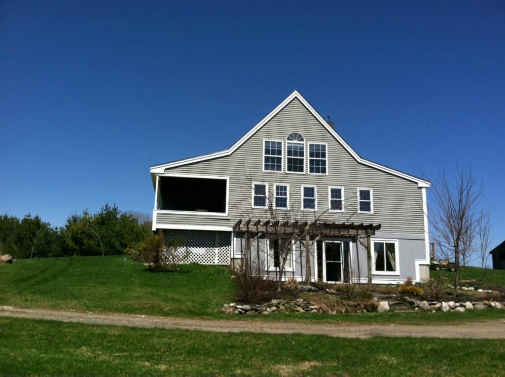 1023 Middle Road Warren, ME 04864 - Photo 1 of 19 Side view showing entry on lower level.
