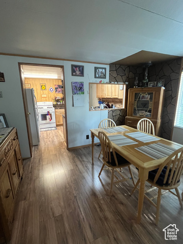 367 East Rio Grande Avenue Marysvale, UT 84750 - Photo 23 of 34 Dining space featuring wood finished floors and crown molding