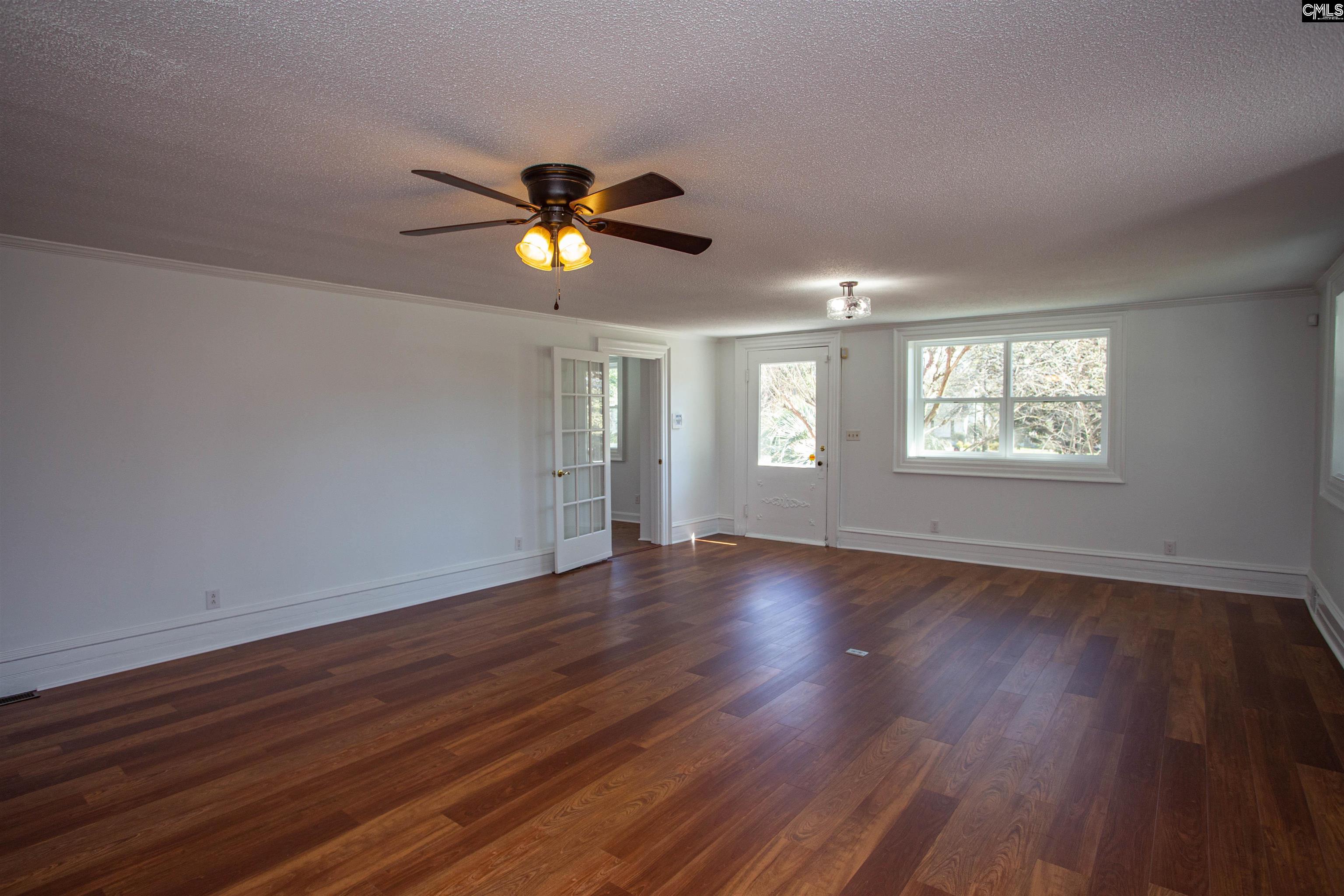 1700 Broad Street Camden, SC 29020 - Photo 5 of 41 a view of an empty room with wooden floor and window