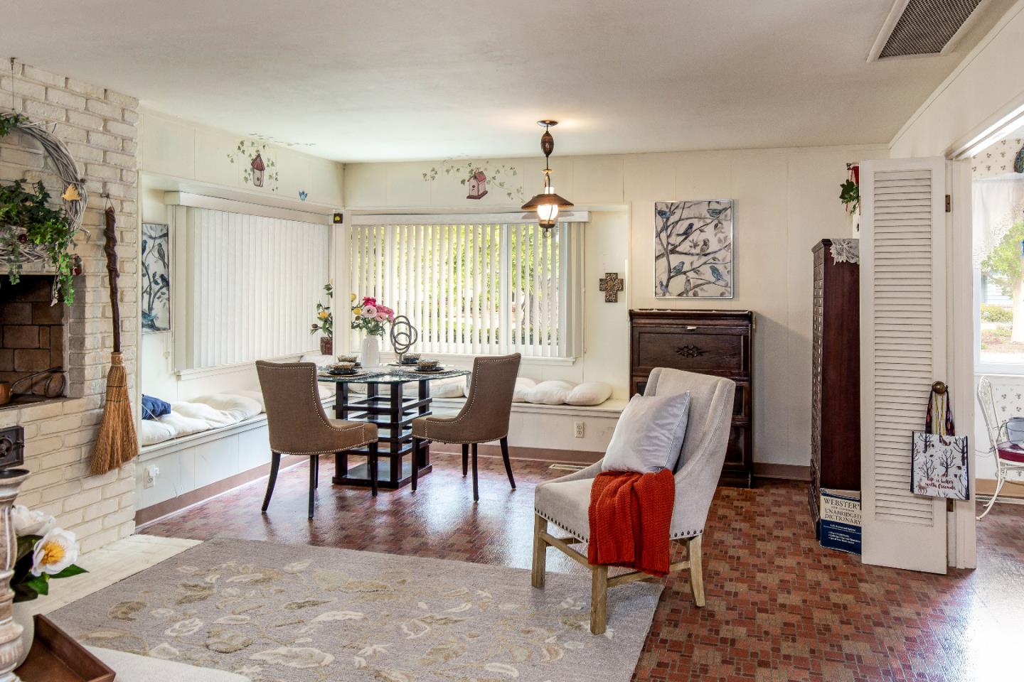 19030 Brookview Drive Saratoga, CA 95070 - Photo 11 of 22 a view of a dining room with furniture window and wooden floor