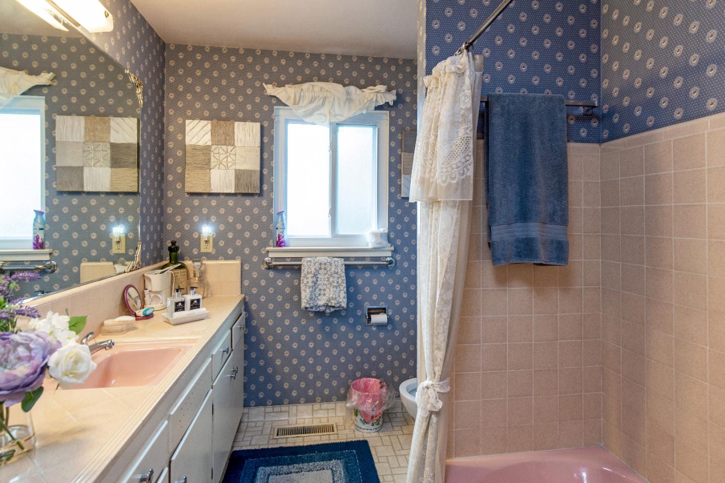 19030 Brookview Drive Saratoga, CA 95070 - Photo 16 of 22 a bathroom with a sink a vanity and a tub