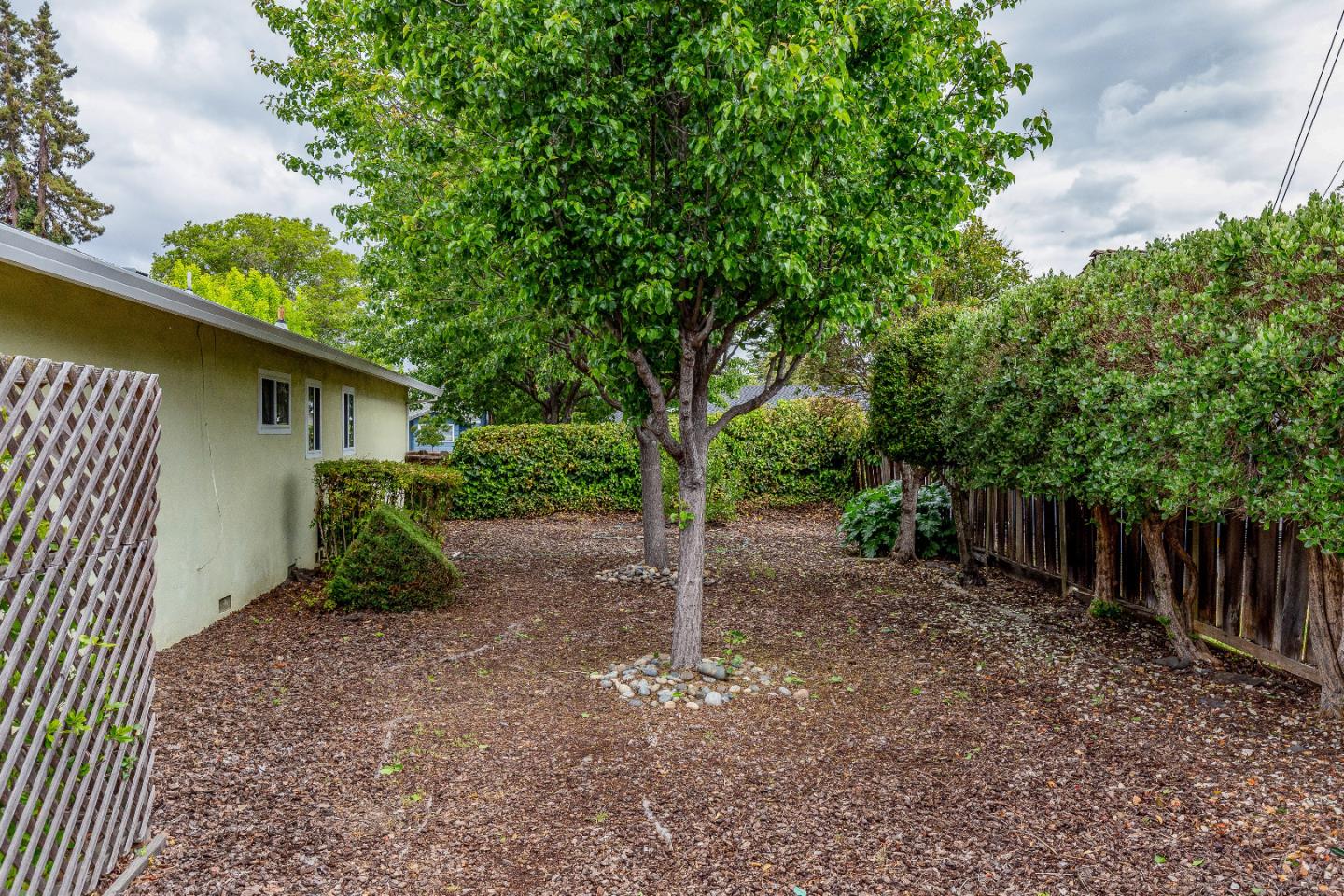 19030 Brookview Drive Saratoga, CA 95070 - Photo 20 of 22 a view of a house with a tree in the background