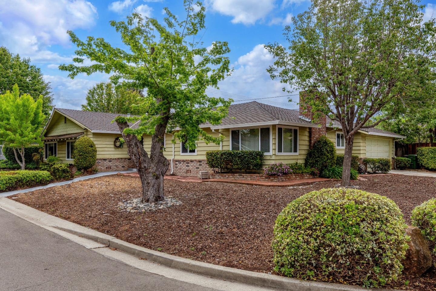 19030 Brookview Drive Saratoga, CA 95070 - Photo 2 of 22 a front view of a house with garden