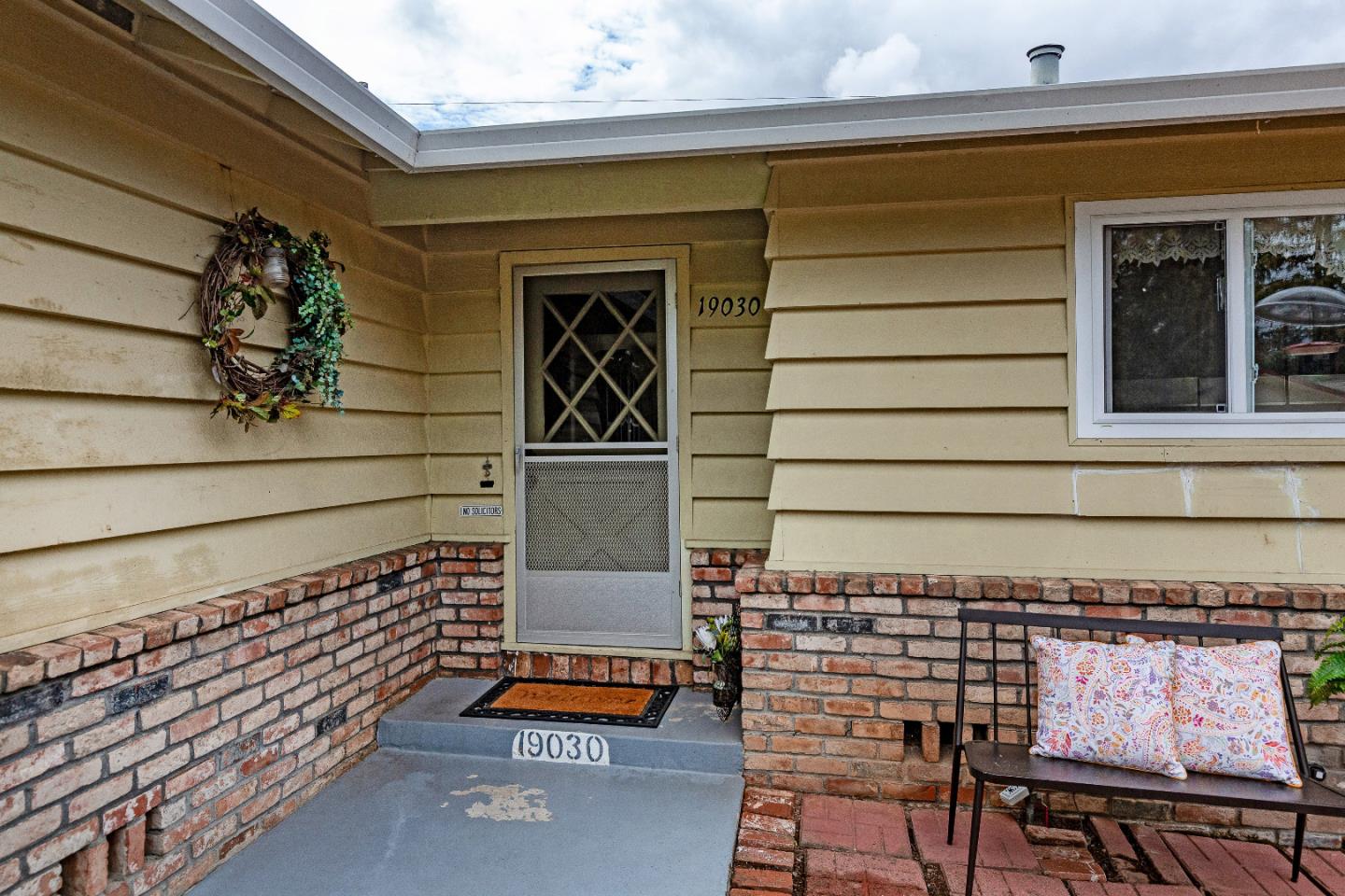 19030 Brookview Drive Saratoga, CA 95070 - Photo 4 of 22 a backyard of a house with barbeque oven table and chairs