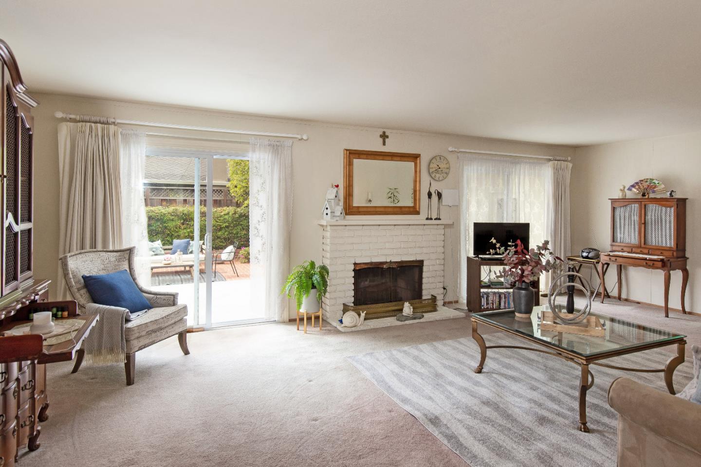 19030 Brookview Drive Saratoga, CA 95070 - Photo 6 of 22 a living room with furniture and a fireplace