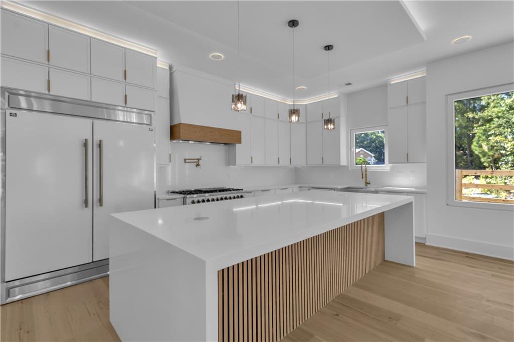 1939 Sunny Hill Road Lawrenceville, GA 30043 - Photo 15 of 47 a kitchen with stainless steel appliances a refrigerator sink and stove