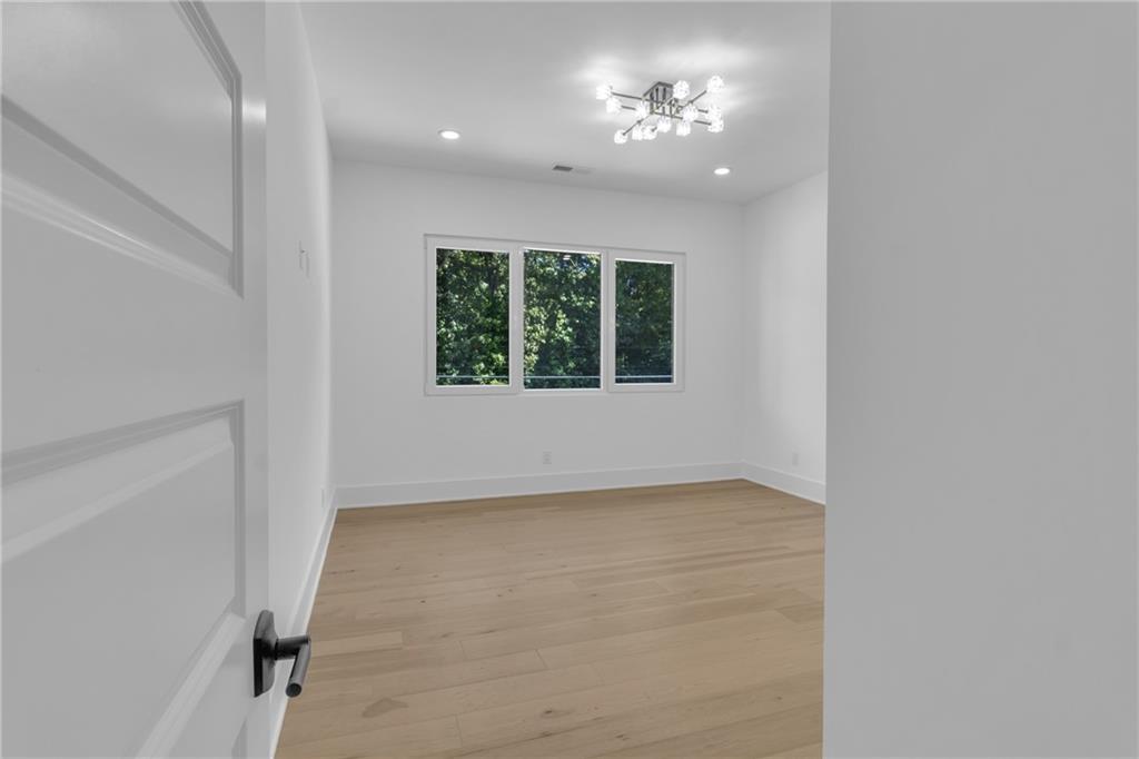 1939 Sunny Hill Road Lawrenceville, GA 30043 - Photo 24 of 47 an empty room with a window