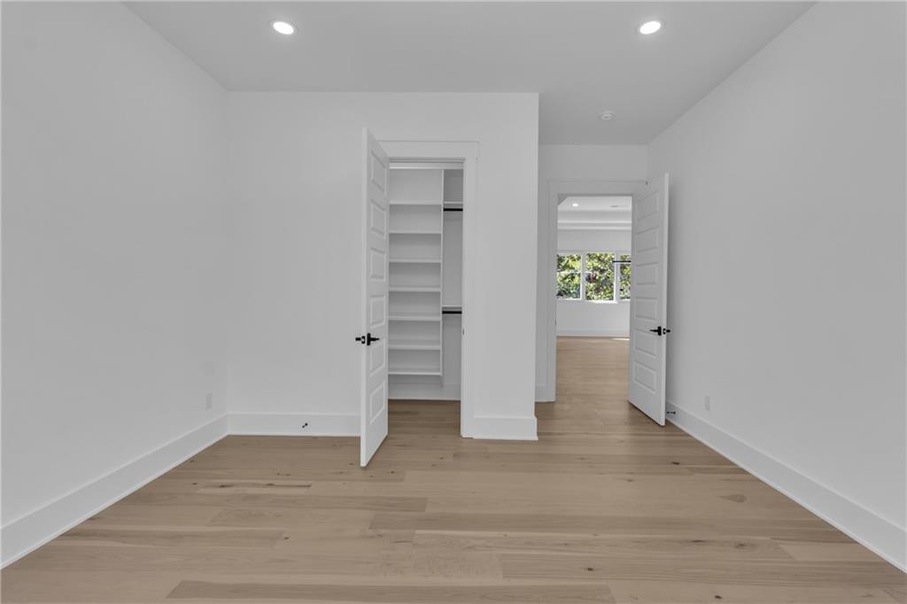 1939 Sunny Hill Road Lawrenceville, GA 30043 - Photo 25 of 47 wooden floor in an empty room