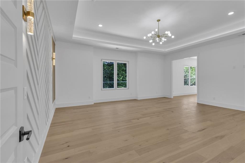 1939 Sunny Hill Road Lawrenceville, GA 30043 - Photo 27 of 47 wooden floor in an empty room with a window