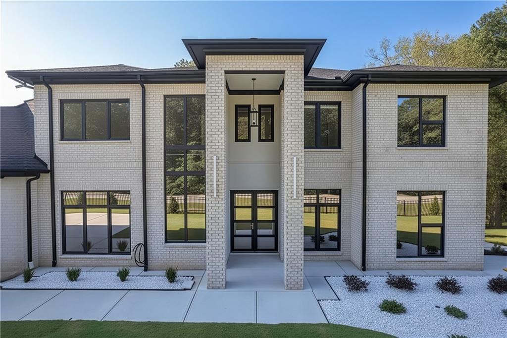 1939 Sunny Hill Road Lawrenceville, GA 30043 - Photo 3 of 47 a view of a house with entrance and windows