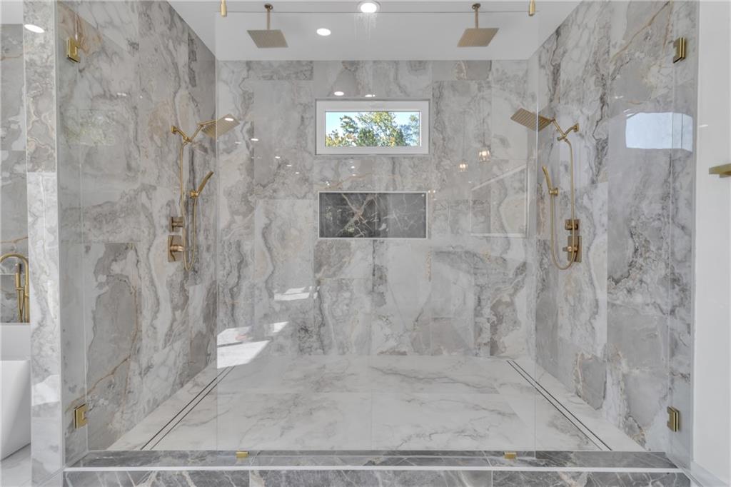 1939 Sunny Hill Road Lawrenceville, GA 30043 - Photo 35 of 47 a bathroom with a shower